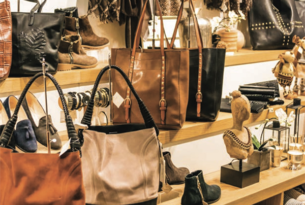 Accessories display with purses at shoe store