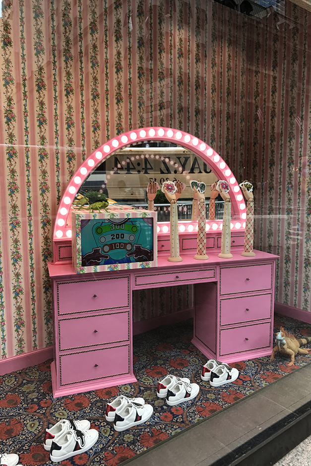 Gucci window display with pink vanity in New York
