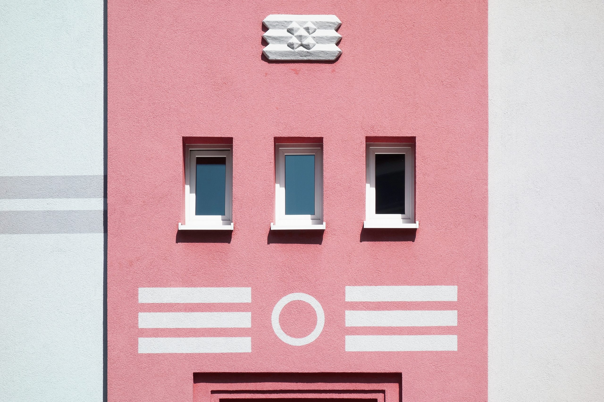Pink building with white stripes