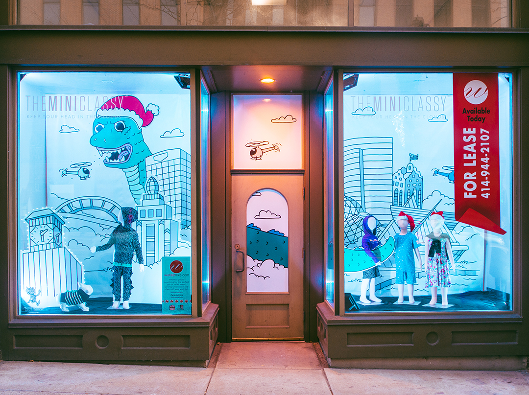 Holiday window display for a Milwaukee children's apparel retailer designed by Retailworks Inc.