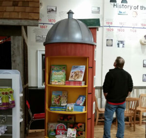 Displays fixtures in the shape of a farm silo