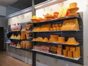Displays with cheese themed retail products merchandised on the wall at the Dairy Heritage Center in Plymouth, Wisconsin