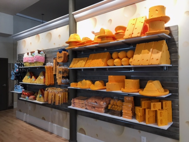 Displays with cheese themed retail products merchandised on the wall at the Dairy Heritage Center in Plymouth, Wisconsin