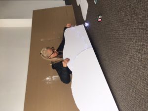 A Retailworks Inc. display artist creating snow banks for a window display